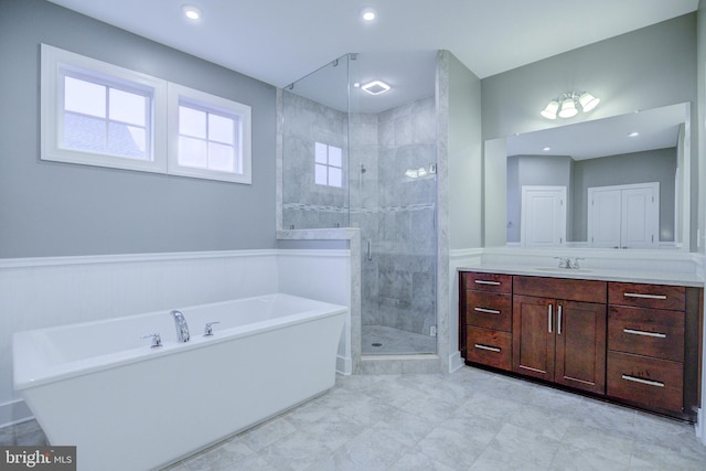 41031 Brook Grove Dr, Aldie, VA 20105 - bathroom featuring a tub, vanity, a shower stall, and recessed lighting