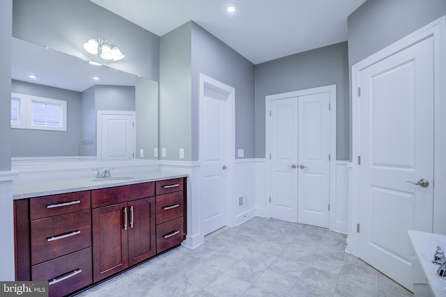 41031 Brook Grove Dr, Aldie, VA 20105 - full bathroom with vanity, wainscoting, and a bath