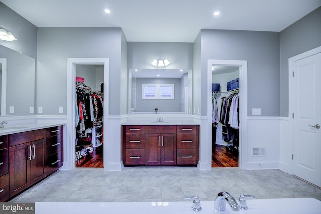 41031 Brook Grove Dr, Aldie, VA 20105 - bathroom with two vanities and a spacious closet