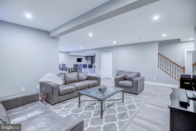 41031 Brook Grove Dr, Aldie, VA 20105 - living area with wood finished floors, stairway, recessed lighting, and baseboards