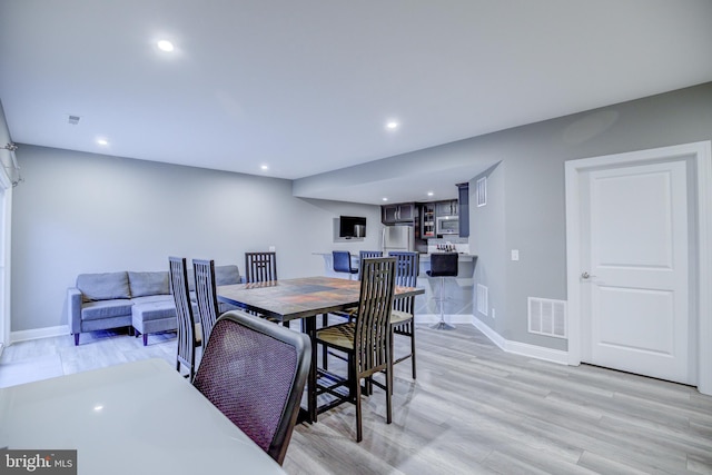41031 Brook Grove Dr, Aldie, VA 20105 - dining room featuring baseboards, recessed lighting, and light wood-style floors