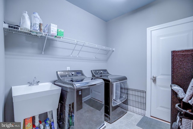 41031 Brook Grove Dr, Aldie, VA 20105 - laundry room with washer and dryer and tile patterned floors