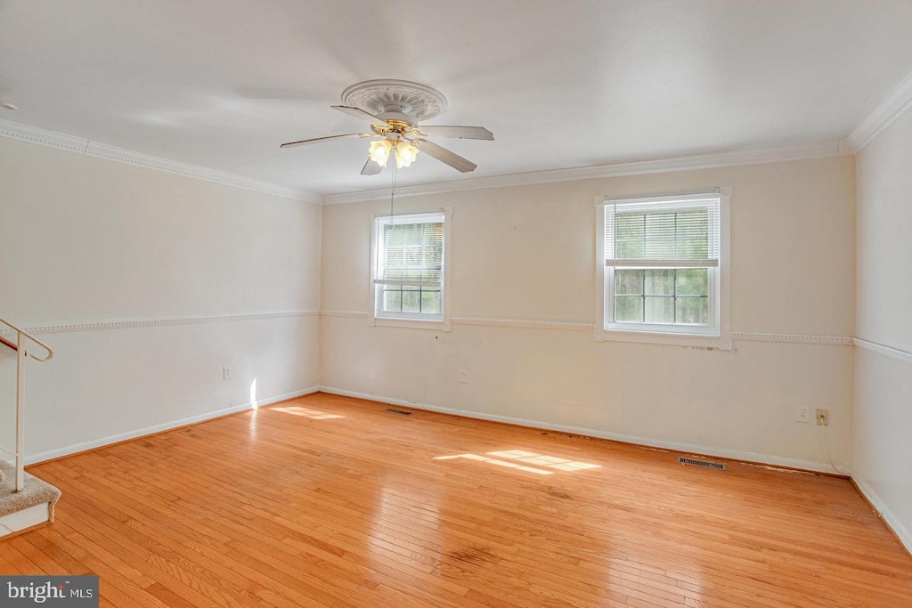 14849 Ensor Ct, Woodbridge, VA 22193 - unfurnished room featuring wood-type flooring, ceiling fan, ornamental molding, and baseboards
