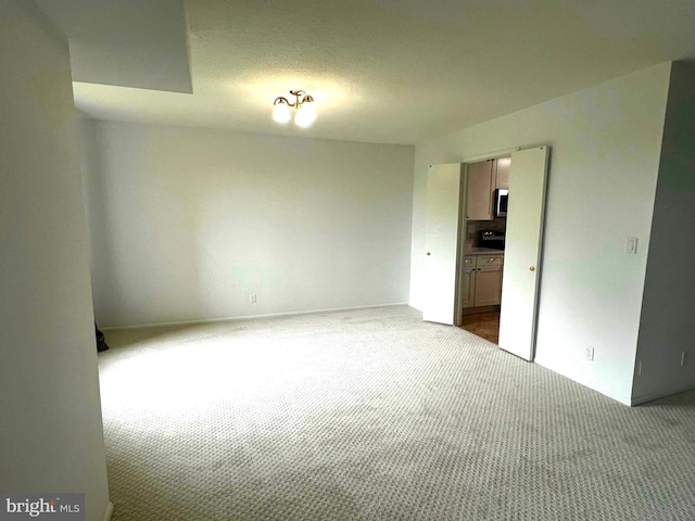 8350 Greensboro Dr Unit 218, Mclean, VA 22102 - carpeted empty room featuring baseboards