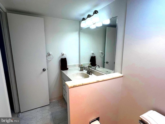 8350 Greensboro Dr Unit 218, Mclean, VA 22102 - bathroom featuring marble look tile flooring and vanity