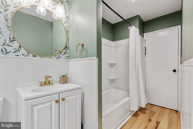 297 Killian Rd, Honey Brook, PA 19344 - bathroom with a wainscoted wall, wood finished floors, vanity, and shower / tub combo with curtain