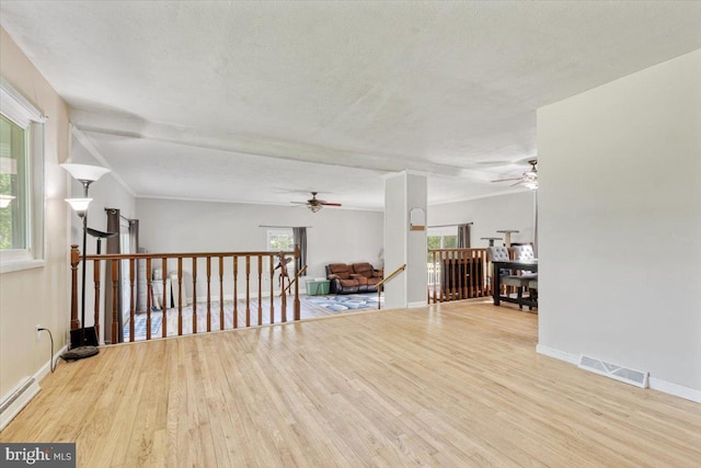 297 Killian Rd, Honey Brook, PA 19344 - unfurnished room featuring a ceiling fan, wood finished floors, and a baseboard radiator