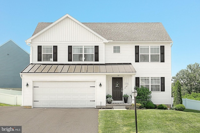 252 Valley View Cir, York, PA 17408 - view of front of property with a standing seam roof, asphalt driveway, roof with shingles, and metal roof