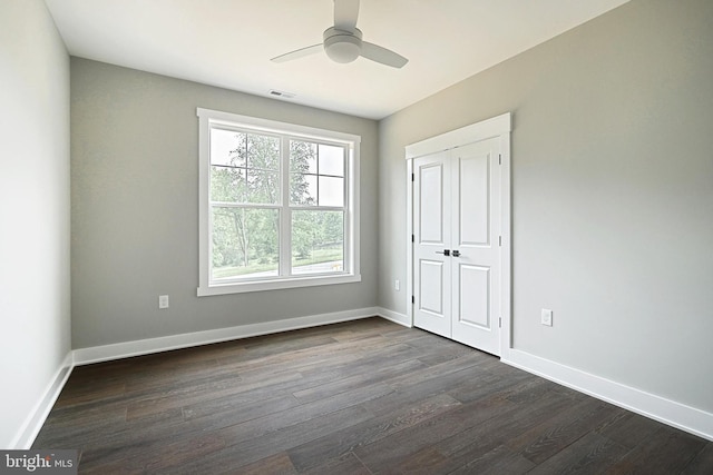 2741 Primrose Ln N, York, PA 17404 - unfurnished bedroom featuring dark wood-type flooring, baseboards, a closet, and a ceiling fan