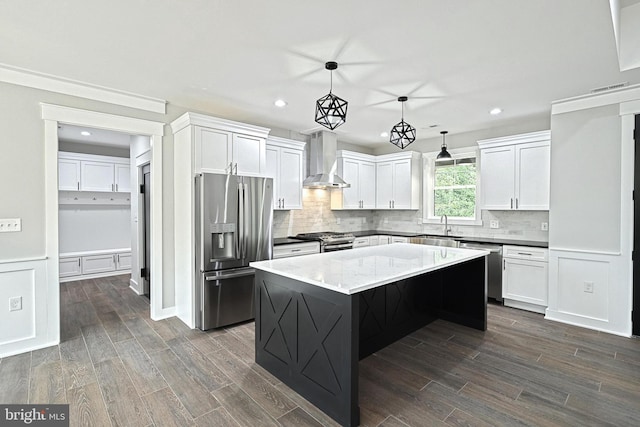 2741 Primrose Ln N, York, PA 17404 - kitchen featuring appliances with stainless steel finishes, wall chimney exhaust hood, recessed lighting, white cabinetry, and dark wood-type flooring