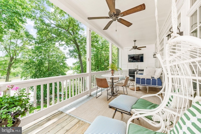 3209 Henson Ave, Annapolis, MD 21403 - wooden terrace with outdoor dining space and a ceiling fan