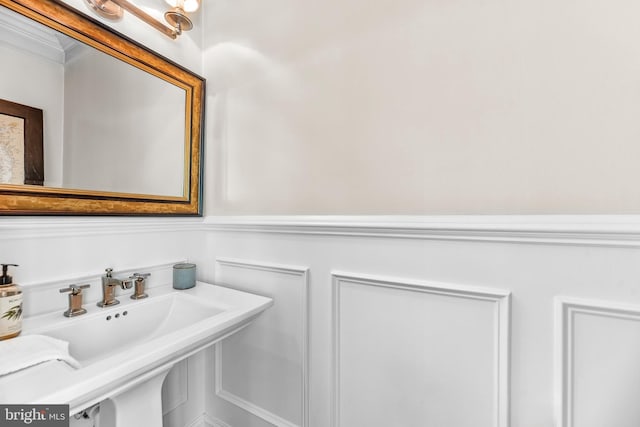 3209 Henson Ave, Annapolis, MD 21403 - bathroom with crown molding and a wainscoted wall
