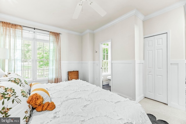 3209 Henson Ave, Annapolis, MD 21403 - bedroom with ornamental molding, a wainscoted wall, a ceiling fan, and a closet