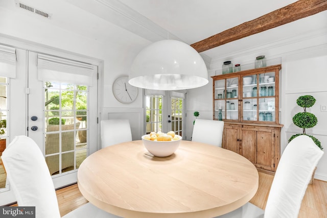 3209 Henson Ave, Annapolis, MD 21403 - dining area featuring french doors, light wood-style floors, and beamed ceiling