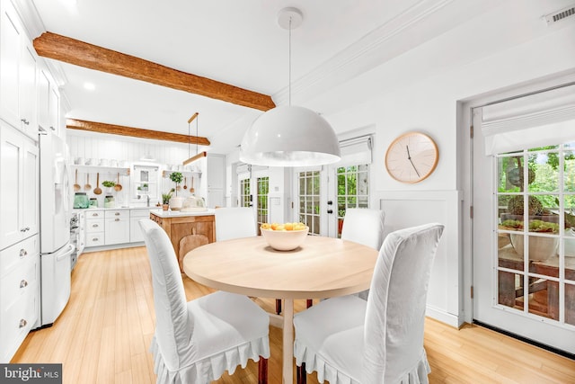 3209 Henson Ave, Annapolis, MD 21403 - dining area with plenty of natural light, beamed ceiling, light wood-style floors, french doors, and recessed lighting