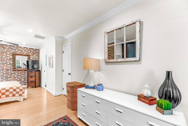 3209 Henson Ave, Annapolis, MD 21403 - bedroom featuring brick wall, ornamental molding, light wood finished floors, and recessed lighting