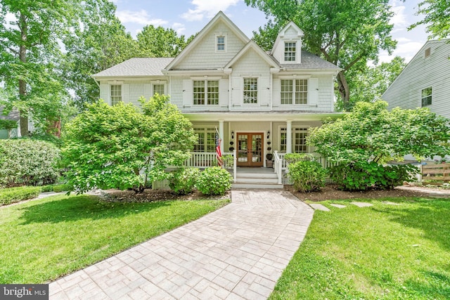 3209 Henson Ave, Annapolis, MD 21403 - view of front of home with french doors, a porch, a front lawn, and roof with shingles