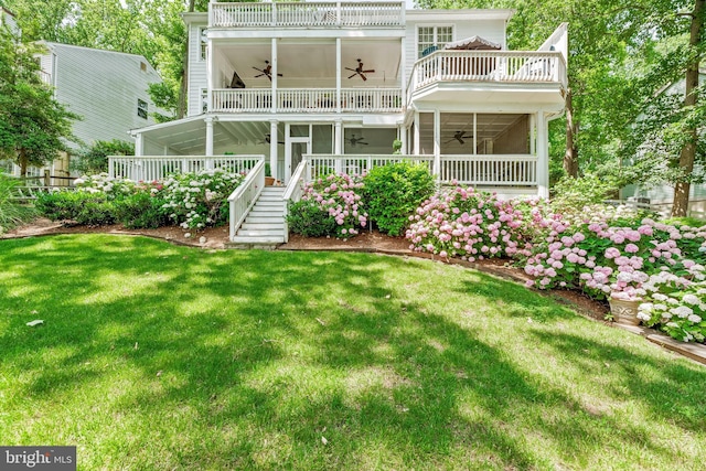3209 Henson Ave, Annapolis, MD 21403 - rear view of property with a ceiling fan, a balcony, a yard, stairway, and a sunroom