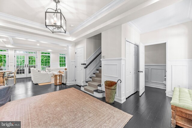3209 Henson Ave, Annapolis, MD 21403 - foyer featuring dark wood finished floors, stairway, crown molding, a decorative wall, and a chandelier