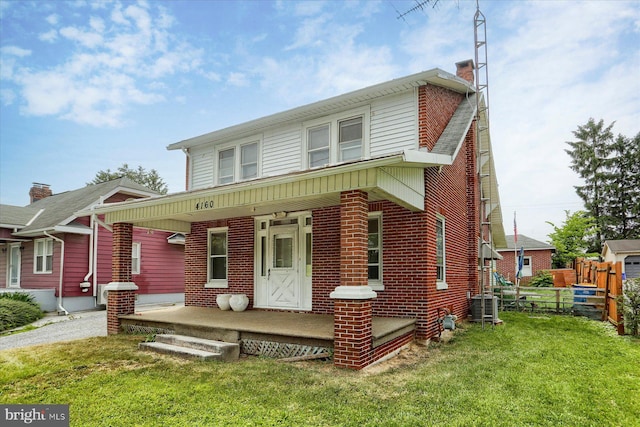 4160 W Market St, York, PA 17408 - view of front of home with cooling unit, covered porch, a chimney, and brick siding
