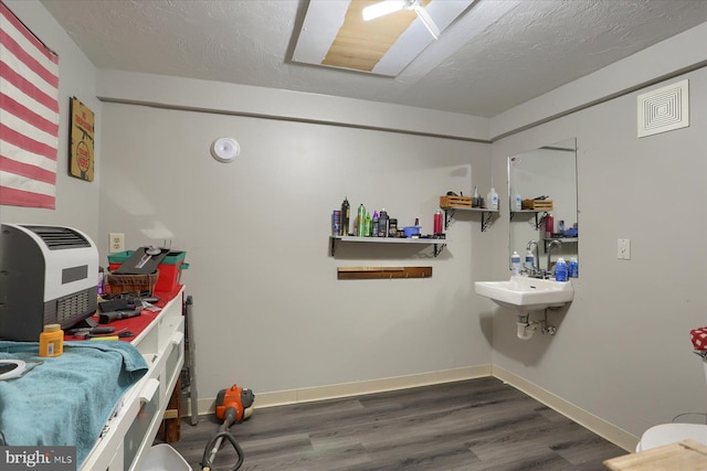 4160 W Market St, York, PA 17408 - bathroom featuring a workshop area, wood finished floors, and baseboards
