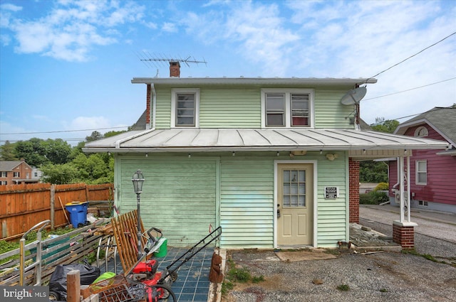 4160 W Market St, York, PA 17408 - rear view of house with a standing seam roof, a chimney, and metal roof