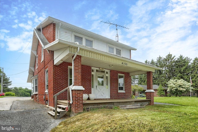 4160 W Market St, York, PA 17408 - view of front of property featuring a porch, a front yard, and brick siding