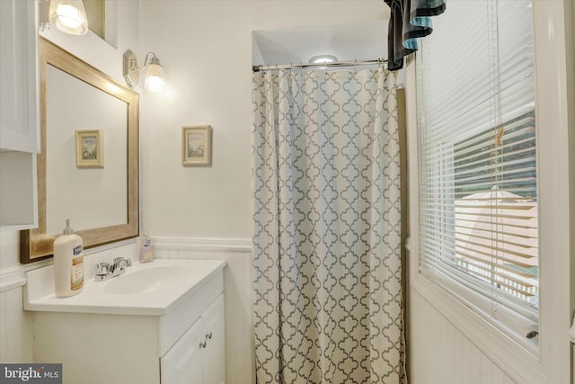 143 Brittany Dr, Chalfont, PA 18914 - full bathroom featuring a decorative wall, vanity, wainscoting, and curtained shower
