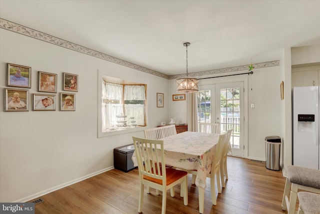 143 Brittany Dr, Chalfont, PA 18914 - dining area with light wood-style floors and a chandelier