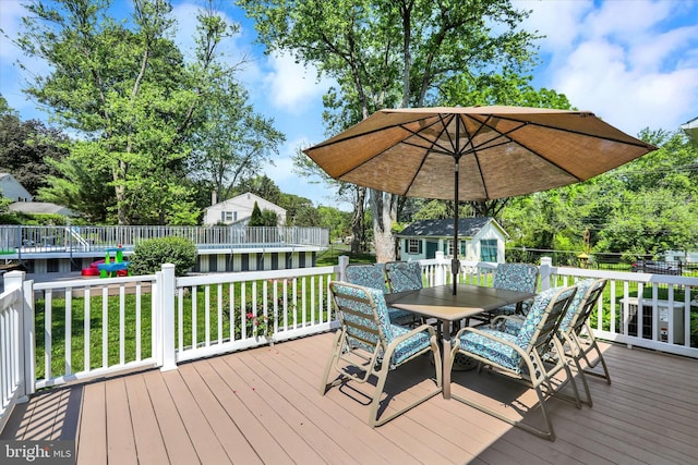 143 Brittany Dr, Chalfont, PA 18914 - wooden terrace featuring outdoor dining space and an outdoor structure