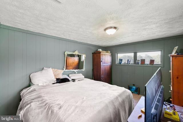 1801 Middle Ridge Rd, Romney, WV 26757 - bedroom with a textured ceiling and a decorative wall