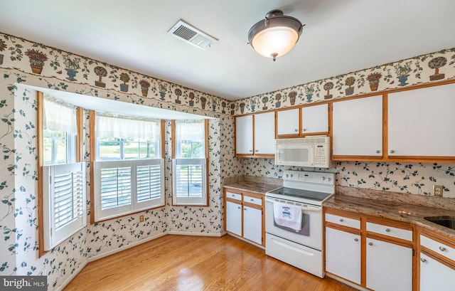 722 Scotch Way Unit C-26, West Chester, PA 19382 - kitchen with white appliances, wallpapered walls, light wood finished floors, and baseboards