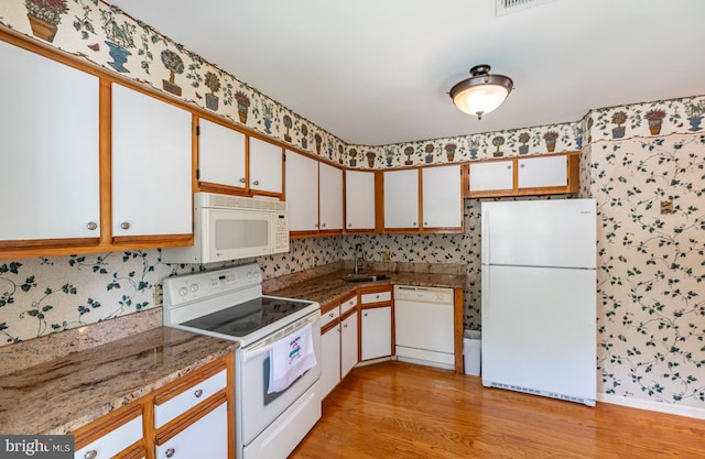 722 Scotch Way Unit C-26, West Chester, PA 19382 - kitchen featuring white appliances, wallpapered walls, light wood finished floors, and a sink