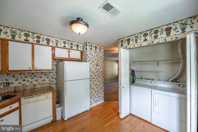 722 Scotch Way Unit C-26, West Chester, PA 19382 - washroom featuring washer and dryer, light wood-style floors, wallpapered walls, and baseboards