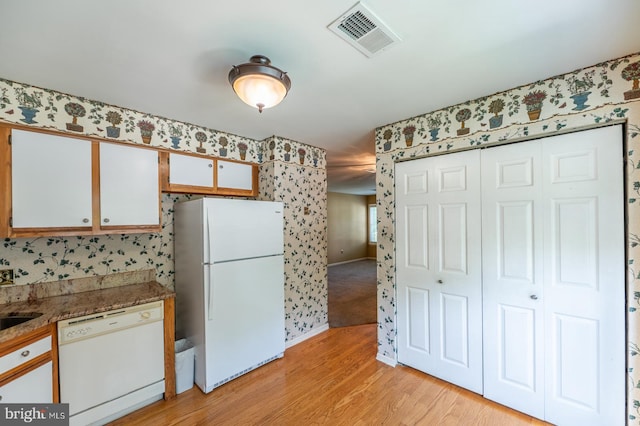 722 Scotch Way Unit C-26, West Chester, PA 19382 - kitchen with white appliances, wallpapered walls, light wood-type flooring, white cabinets, and baseboards