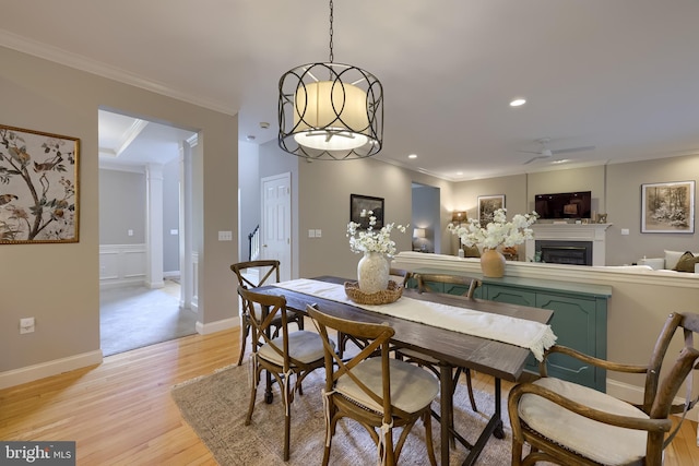 2149 Colleens Way, Lancaster, PA 17601 - dining area featuring light wood finished floors, ornamental molding, a fireplace, recessed lighting, and a ceiling fan