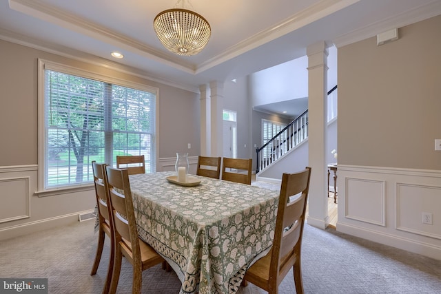 2149 Colleens Way, Lancaster, PA 17601 - dining room with decorative columns, carpet flooring, a wainscoted wall, crown molding, and a chandelier