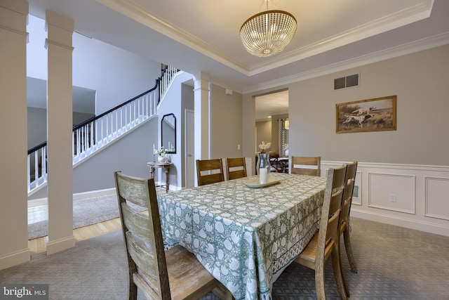 2149 Colleens Way, Lancaster, PA 17601 - dining space featuring decorative columns, carpet flooring, a chandelier, crown molding, and stairway