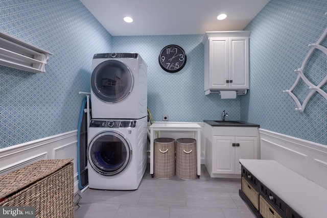 2149 Colleens Way, Lancaster, PA 17601 - washroom with estacked washer and dryer, wainscoting, cabinet space, and light tile patterned floors