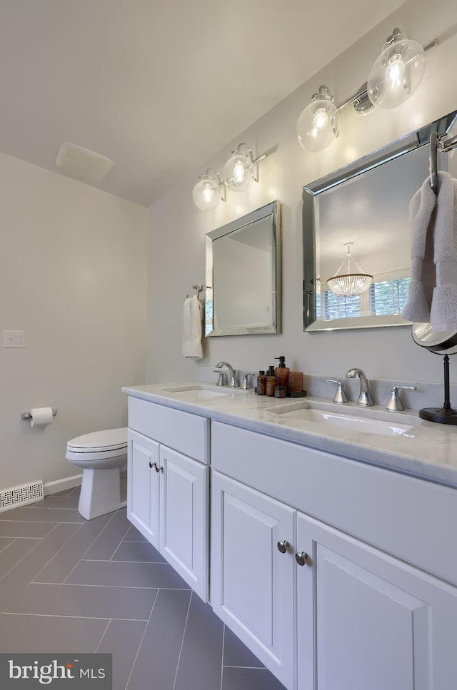 2149 Colleens Way, Lancaster, PA 17601 - full bathroom featuring double vanity, tile patterned flooring, toilet, and baseboards