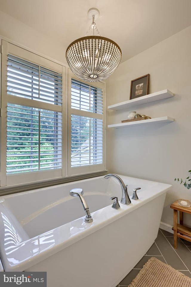 2149 Colleens Way, Lancaster, PA 17601 - full bath with plenty of natural light, a tub to relax in, a chandelier, and tile patterned flooring