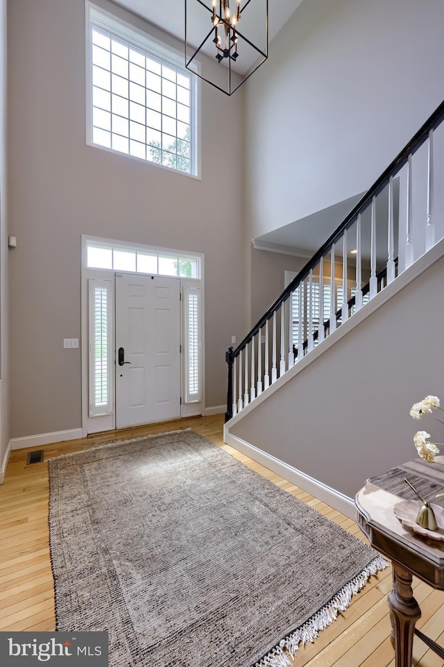 2149 Colleens Way, Lancaster, PA 17601 - foyer entrance with a high ceiling, wood finished floors, a chandelier, baseboards, and stairway