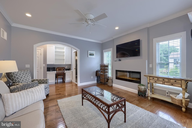 2149 Colleens Way, Lancaster, PA 17601 - living area with wood finished floors, ornamental molding, ceiling fan, arched walkways, and a glass covered fireplace