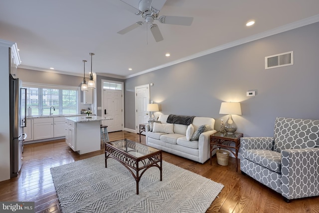 2149 Colleens Way, Lancaster, PA 17601 - living area with ceiling fan, wood finished floors, crown molding, recessed lighting, and baseboards