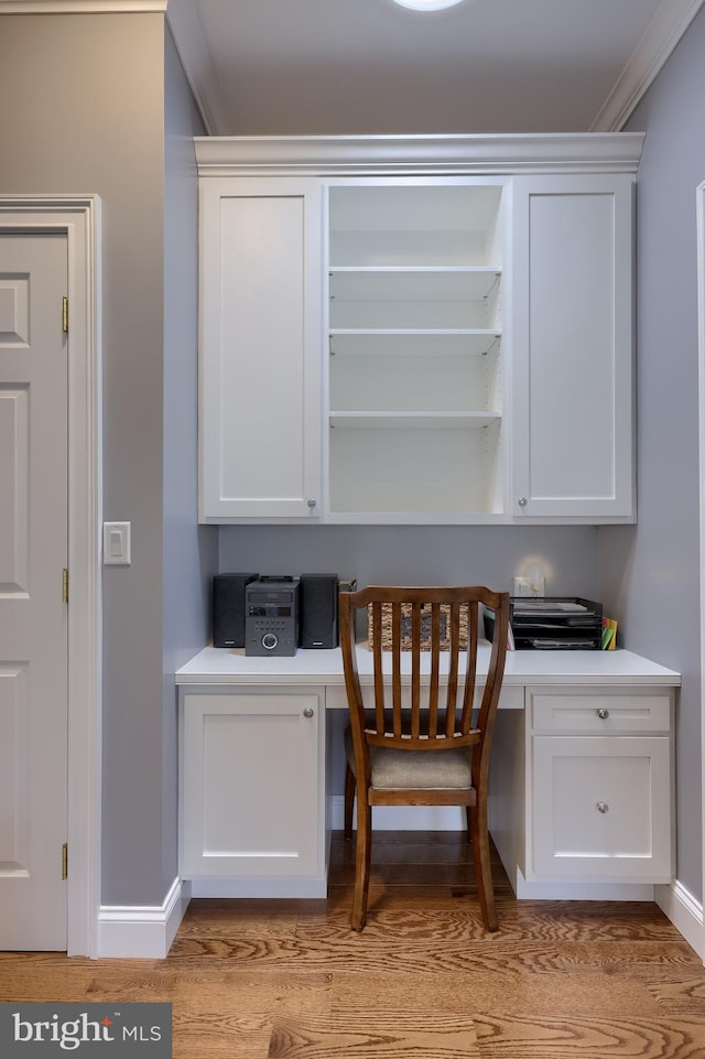2149 Colleens Way, Lancaster, PA 17601 - home office with built in desk, crown molding, light wood finished floors, and baseboards