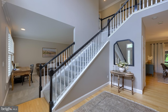 2149 Colleens Way, Lancaster, PA 17601 - staircase with crown molding, wood finished floors, baseboards, recessed lighting, and a towering ceiling