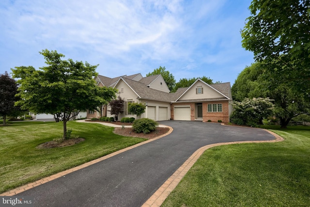 2149 Colleens Way, Lancaster, PA 17601 - view of front of home featuring an attached garage, brick siding, driveway, and a front yard
