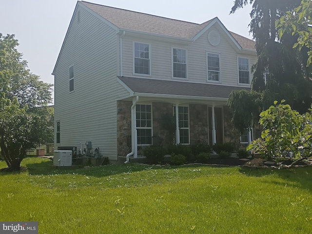 102 Summit Pl, Lansdale, PA 19446 - view of front of home featuring stone siding, cooling unit, a front lawn, and roof with shingles