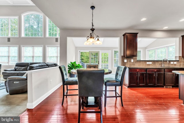 3913 Rolling Paddock Dr, Upper Marlboro, MD 20772 - dining area with hardwood / wood-style floors, healthy amount of natural light, recessed lighting, a chandelier, and baseboards