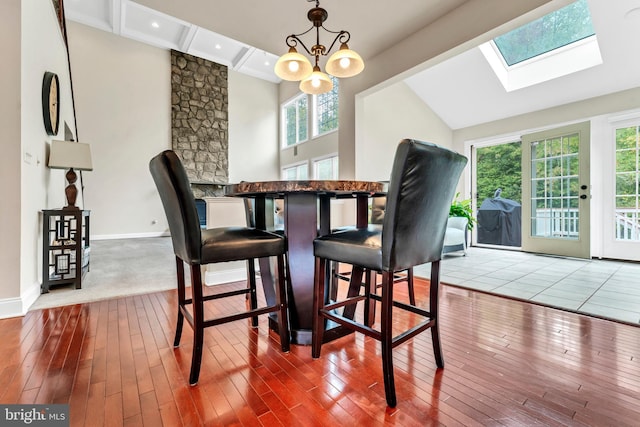 3913 Rolling Paddock Dr, Upper Marlboro, MD 20772 - dining room with plenty of natural light, a skylight, hardwood / wood-style flooring, baseboards, and beamed ceiling